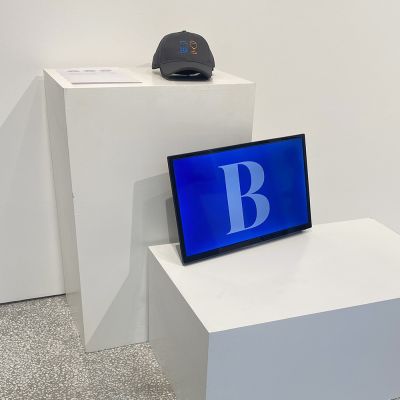 Drawings of two glasses on paper in the gallery