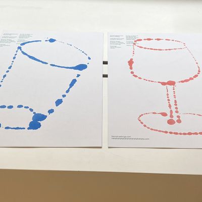 Drawings of two glasses on paper in the gallery