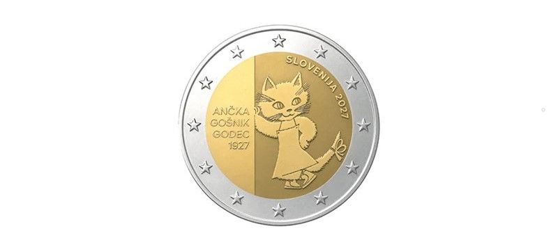 Oblikovni predlog spominskega kovanca za 2 evra. Na sredini kovanca je upodobljena ilustracija Muce Copatarice, ob njej pa napisi »ANČKA GOŠNIK GODEC 1927«, »SLOVENIJA 2027«. Kovanec je srebrno-zlate barve z dvanajstimi zvezdami na zunanjem obroču.