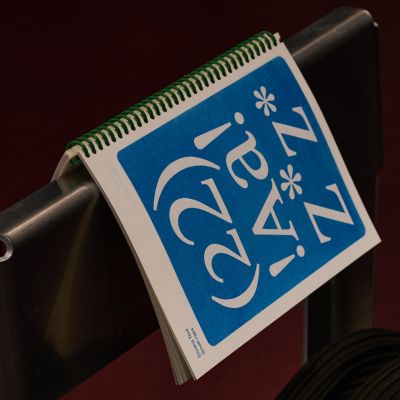 Drawings of two glasses on paper in the gallery